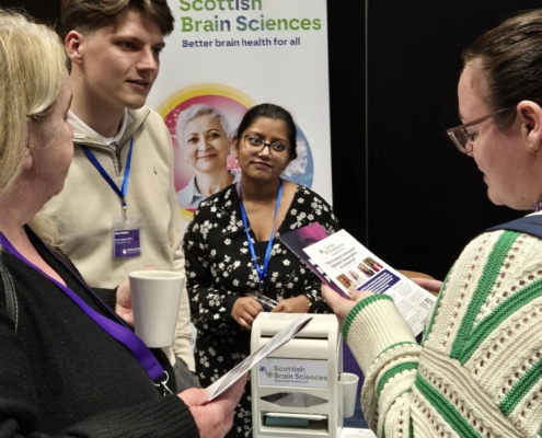 A group of people talking at an event