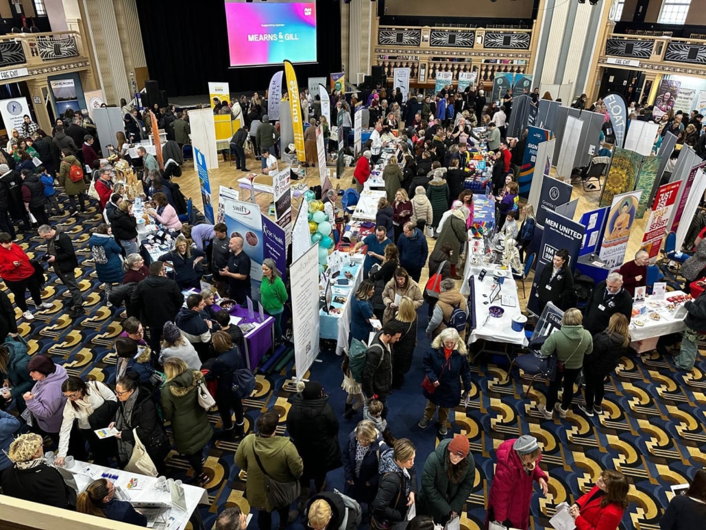 Aberdeen Health and Wellbeing Festival in 2025 Lots of people milling around stands in a large room