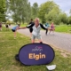 A man in running gear standing in park